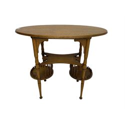 Early to mid-20th century oak occasional table, oval top over under-tier with scrolled foliate edges, connected to two circular lower tiers with spindle supports