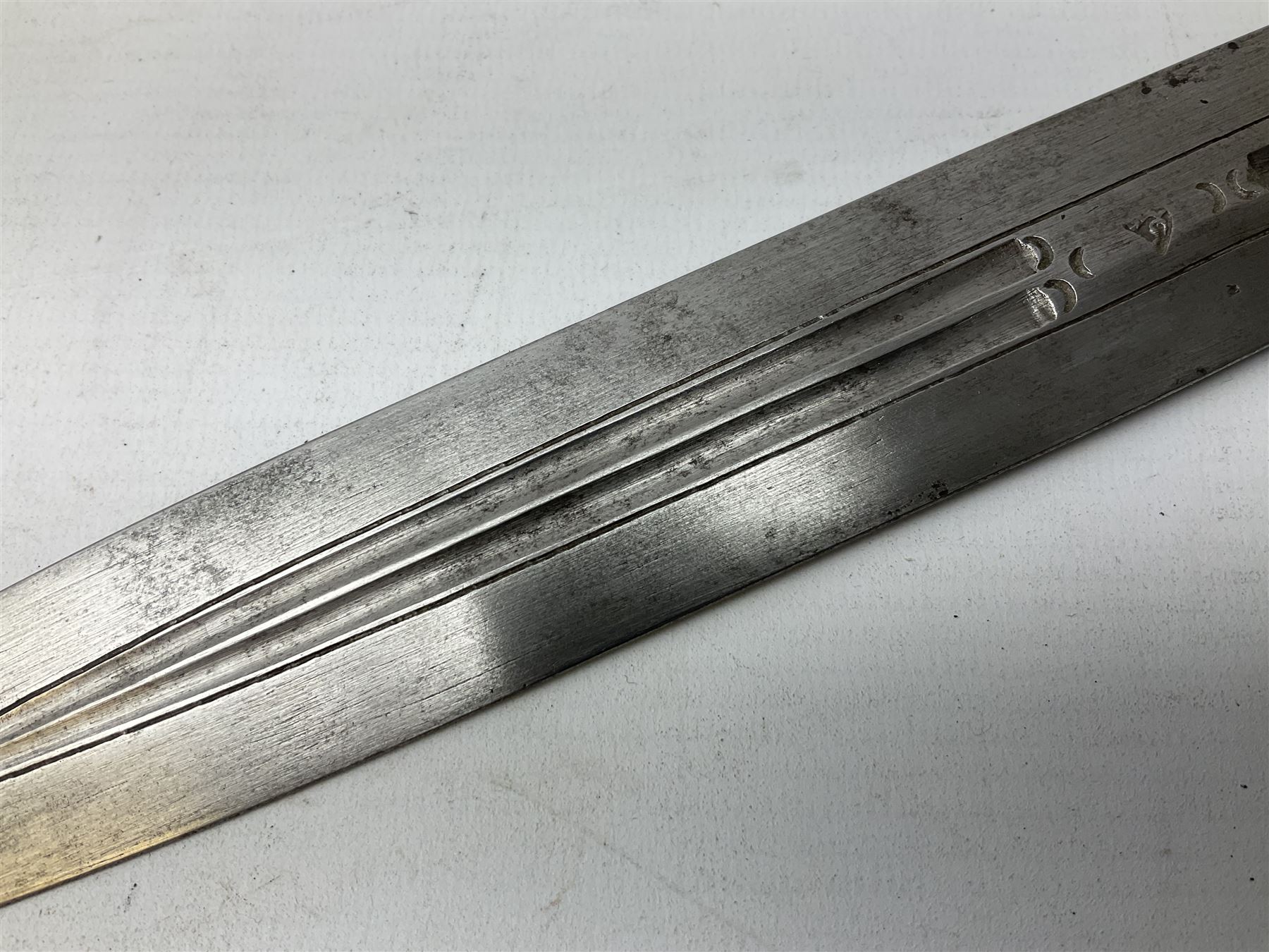 19th century Khanjali dagger, 33.5 cm double edged fullered blade with stamped makers marks, ornate cast grip, with engraved white metal scabbard, 46cm overall