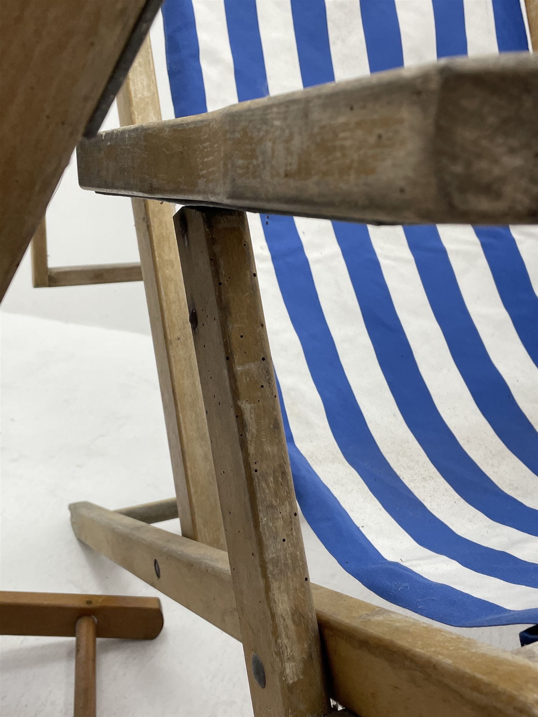 Geebro - ‘The Ocean Chair’ two vintage beech framed folding deck chairs with blue and white striped fabric 