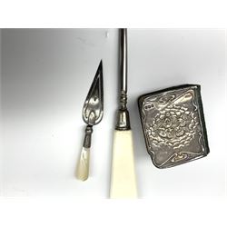Cased silver handled glove stretcher, button hook, shoe horn, etc., hallmarked Adie & Lovekin Ltd, Chester 1911, and Adie & Lovekin Ltd, Birmingham 1911, miniature silver mounted hymn book, the cover embossed with cherubs, silver handled button hook, ivory handled button hook with silver ferrule, two silver dressing table pot lids, etc. 