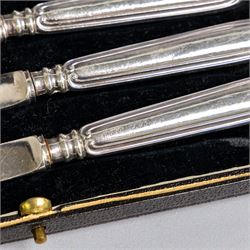 Set of six 1920s silver teaspoons with engraved initials, together with two sets of silver handled tea and fruit knives, all hallmarked and all within fitted cases
