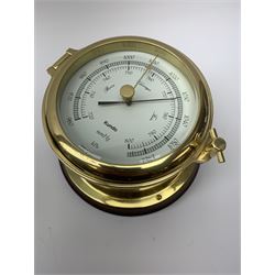 Kundo brass port hole style barometer, D15.5cm together with a set of 19th century brass jeweller's balance scales, on mahogany drawer-fitted base (2)