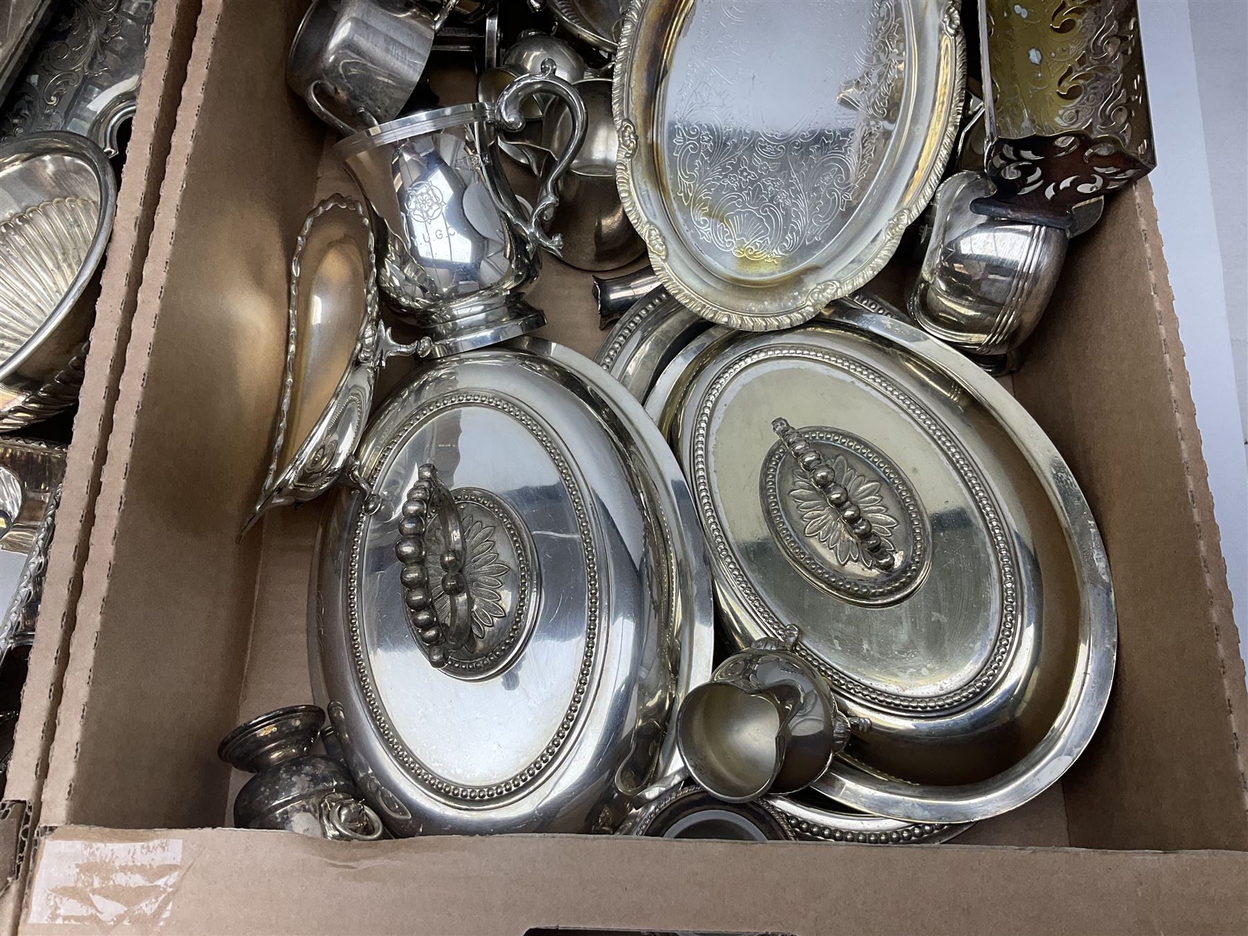 Quantity of silver plate and other metal ware, including sugar caster, tureens, serving dishes, pair of candelabra etc, in two boxes 