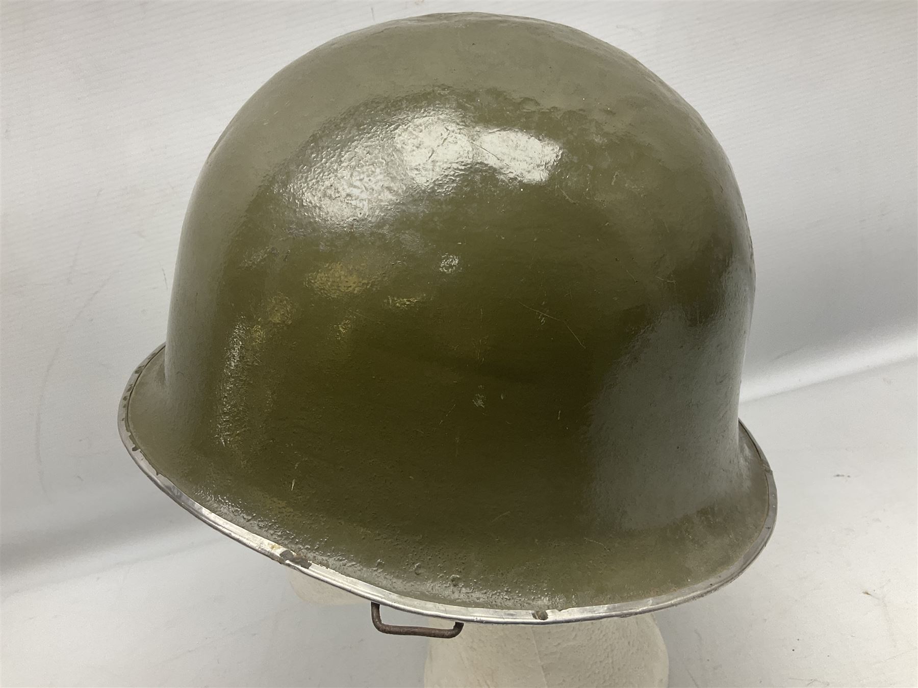 1950s French Algerian War steel helmet with liner; indistinctly marked 'S.I.A. LE EANS(?) 71R'