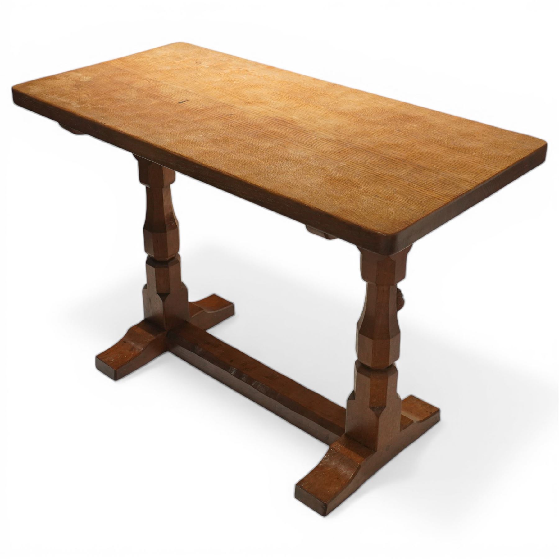Mouseman - oak side table, rectangular adzed top, raised on octagonal supports united by stretcher on sled feet, with carved mouse signature, by the workshop of Robert Thompson of Kilburn