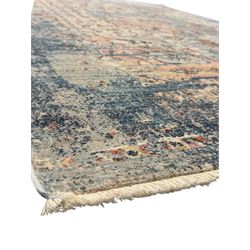 Contemporary Dunelm Soraya Persian design rug, blue and beige ground with faded floral and vine motifs, central medallion and trailing foliate patterns, bordered by a distressed design with stylised floral motifs
