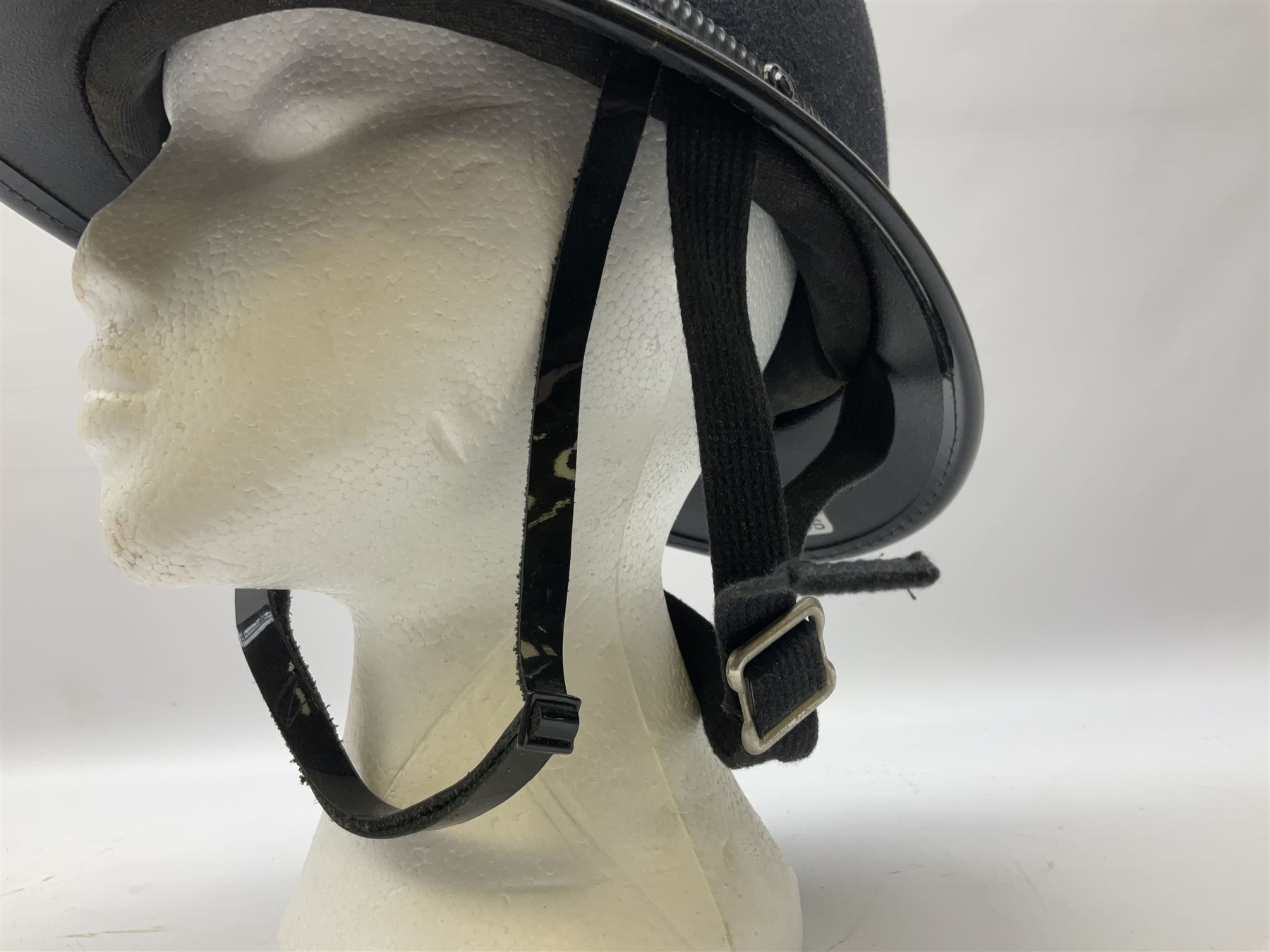 British Transport Police Custodian helmet with Queen's Crown plate; Hiatt & Co ebonised hardwood patrol truncheon; and pair of Hiatts 1960 hand-cuffs (3)