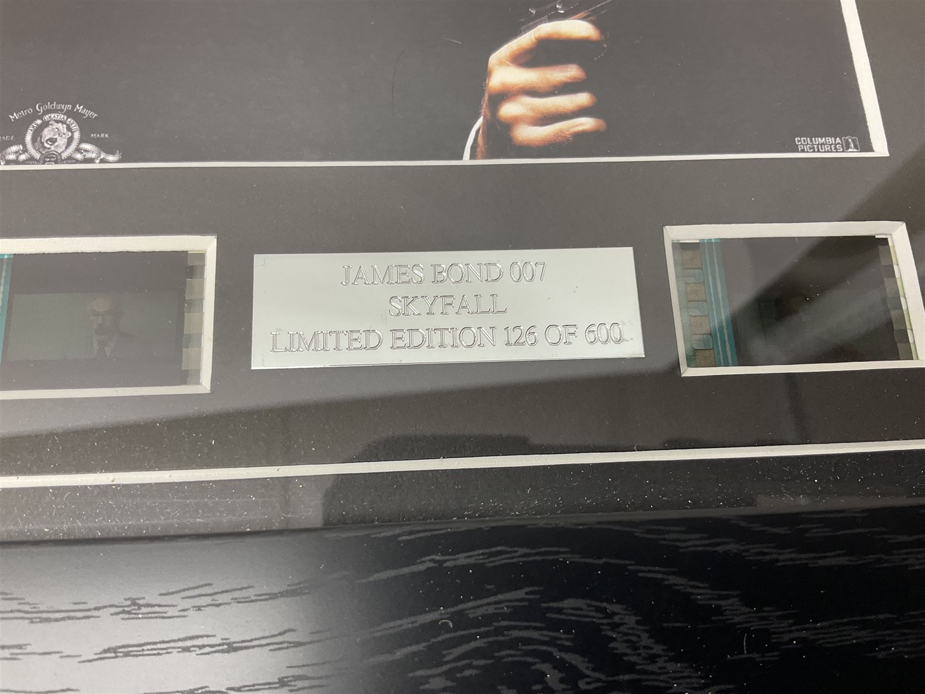 Limited edition framed James Bond 007 Skyfall print, 126/600, boxed Spectre pen, Aston Martin DB5 keyring and sealed 007 50th Anniversary Edition boxed monopoly game (4)