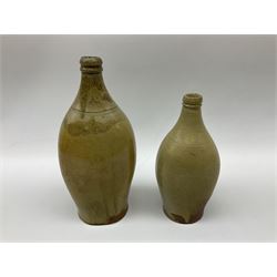  19th century salt glazed stoneware gin bottle impressed John Shaw, Red Lion Vaults, Whitefriargate, Hull of bulbous oval form H27cm and another with impressed label for J. Christie Mytongate Hull (2)  
