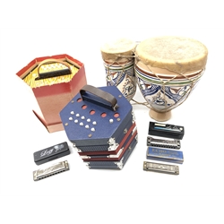  German BM Concertina no. 2119 with 20 keys, a similar Concertina, unboxed, Lee Oskar Harmonica, M. Hohner 'Echo' harmonica, one other and a pair of pottery bongo drums (6)  
