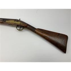 Early 19th century 15-bore flintlock converted to percussion cap fowling piece, the lock stamped T. Richards, walnut half stock with brass fittings including trigger guard with pineapple finial and 91cm barrel with ramrod under L129cm overall