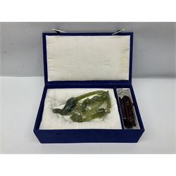 Carved jade figure of a phoenix perched on a flowering branch, upon a wooden stand, with original box, H27cm