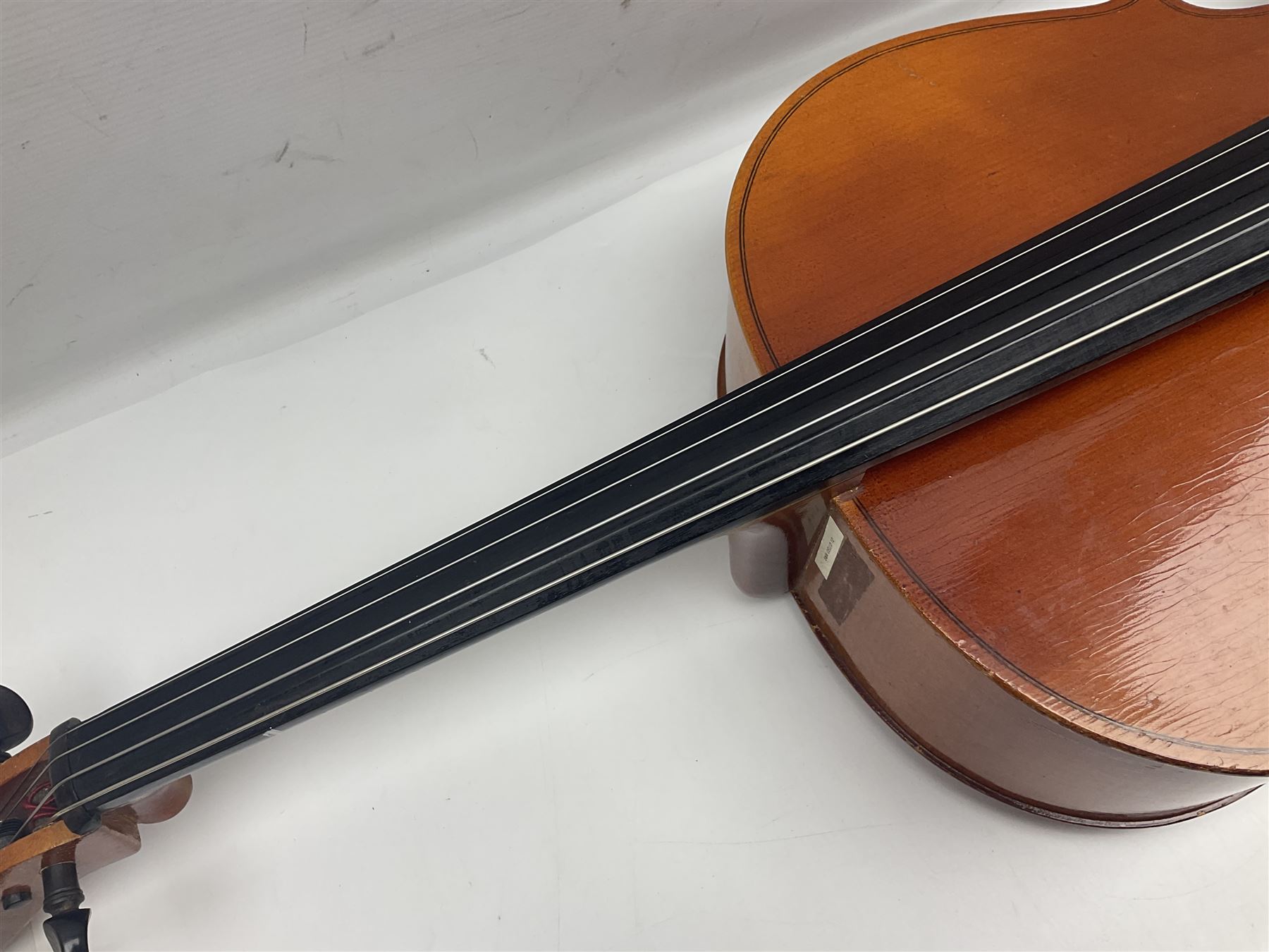 German half-size cello with 69cm two-piece maple back and ribs and spruce top; L112.5cm overall; in soft carrying case with two bows