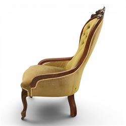 Victorian mahogany green upholstered nursing chair, balloon back with carved cresting rail, button back upholstered with low swept arms, raised on cabriole supports
