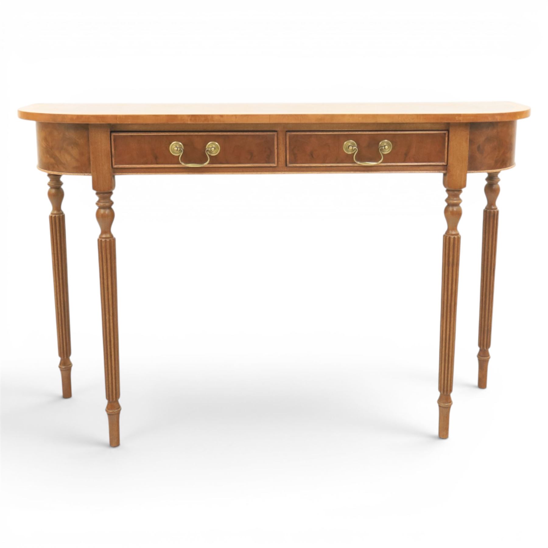 Traditional design walnut D-end hall table, figured top and sides, two frieze drawers with brass handles raised on fluted and turned supports