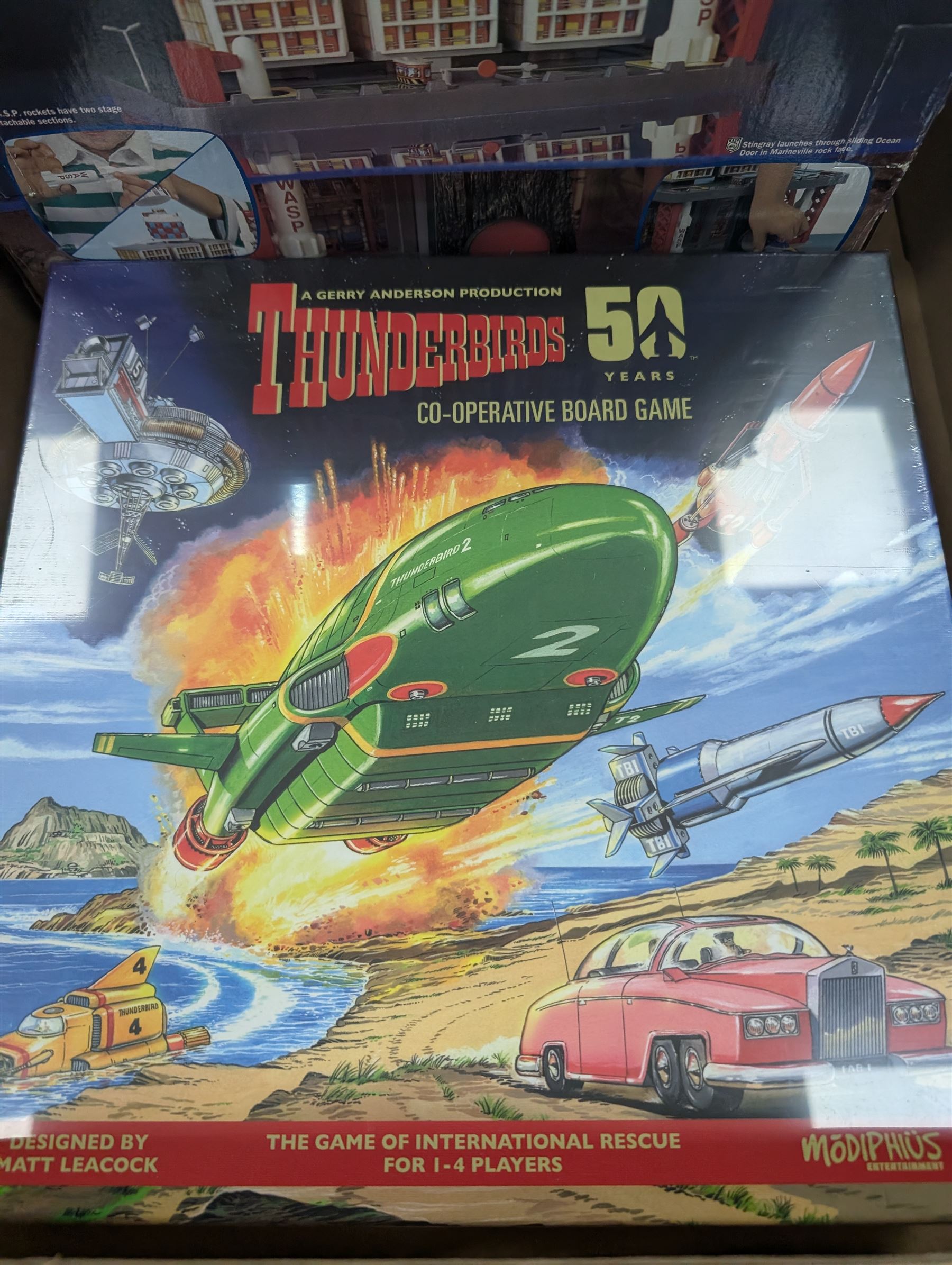 Gerry Anderson interest collectables and toys, including Carlton Thunderbirds Tracy Island, Matchbox Stingray Marineville Headquarters, both boxed, Matchbox carded Thunderbirds and Stingray figures and vehicles, Captain Scarlet and Joe90 collectables, etc