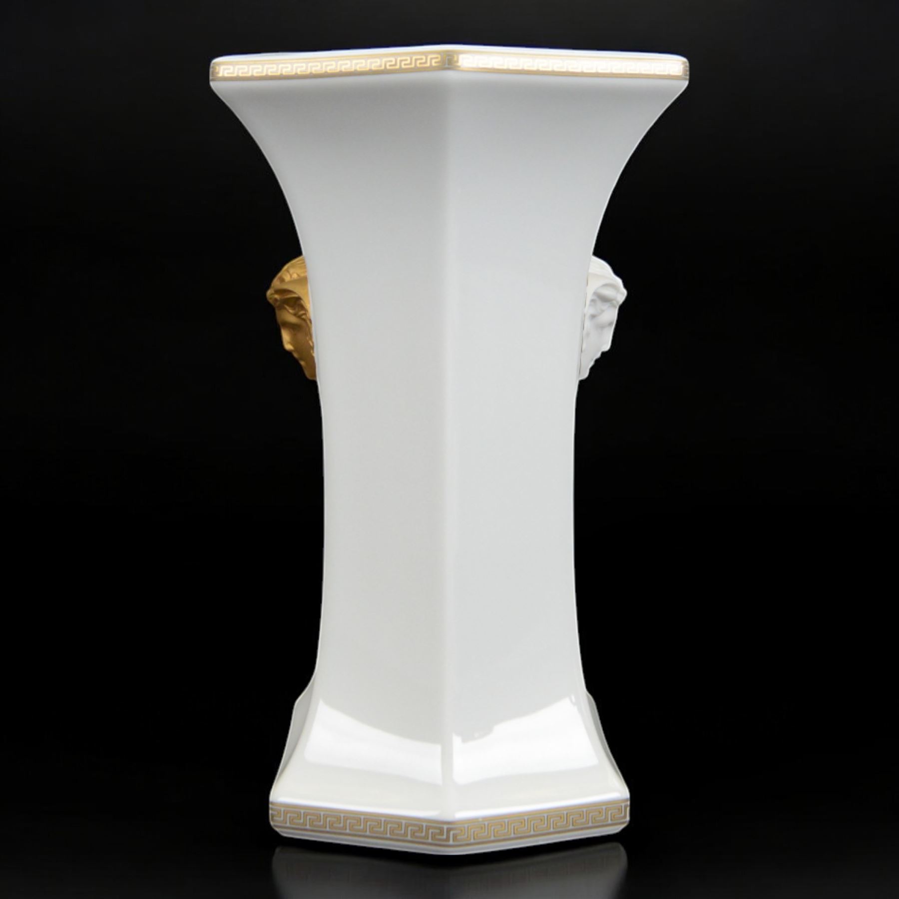 Rosenthal Versace Gorgona vase, of rectagular form with fluted base and rim, decorated in relief with medusa masks and gilt greek key borders upon a white ground, boxed, H23cm