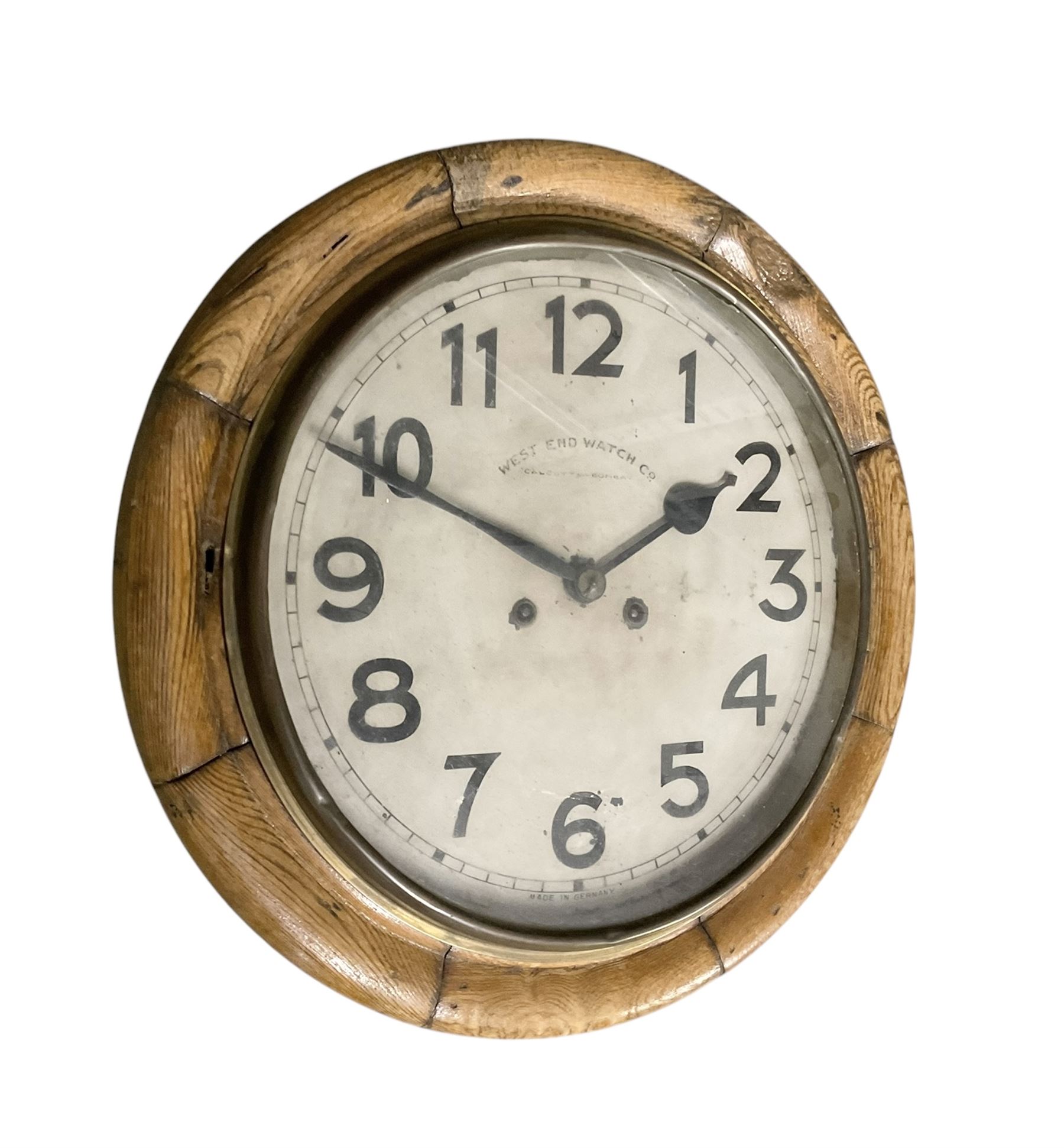 Early 20th century German spring driven striking wall clock with a 12” painted dial and spun bezel.