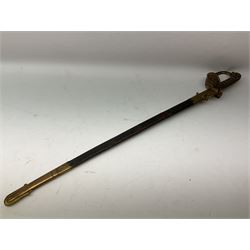 Early Victorian Royal Naval Officer's sword, with 76cm slightly curving fullered blade marked Selby High Street Portsmouth to the ricasso, etched with crowned fouled anchor, Royal Arms with supporters and motto, in scrolled fenestrated panels, regulation brass half basket hilt, with turn down langet engraved with the initials EGTG, and incorporating crowned fouled anchor, lion's head pommel with mane backstrap, wire-bound white sharkskin grip; in brass mounted leather scabbard also with maker's mark L91cm overall
