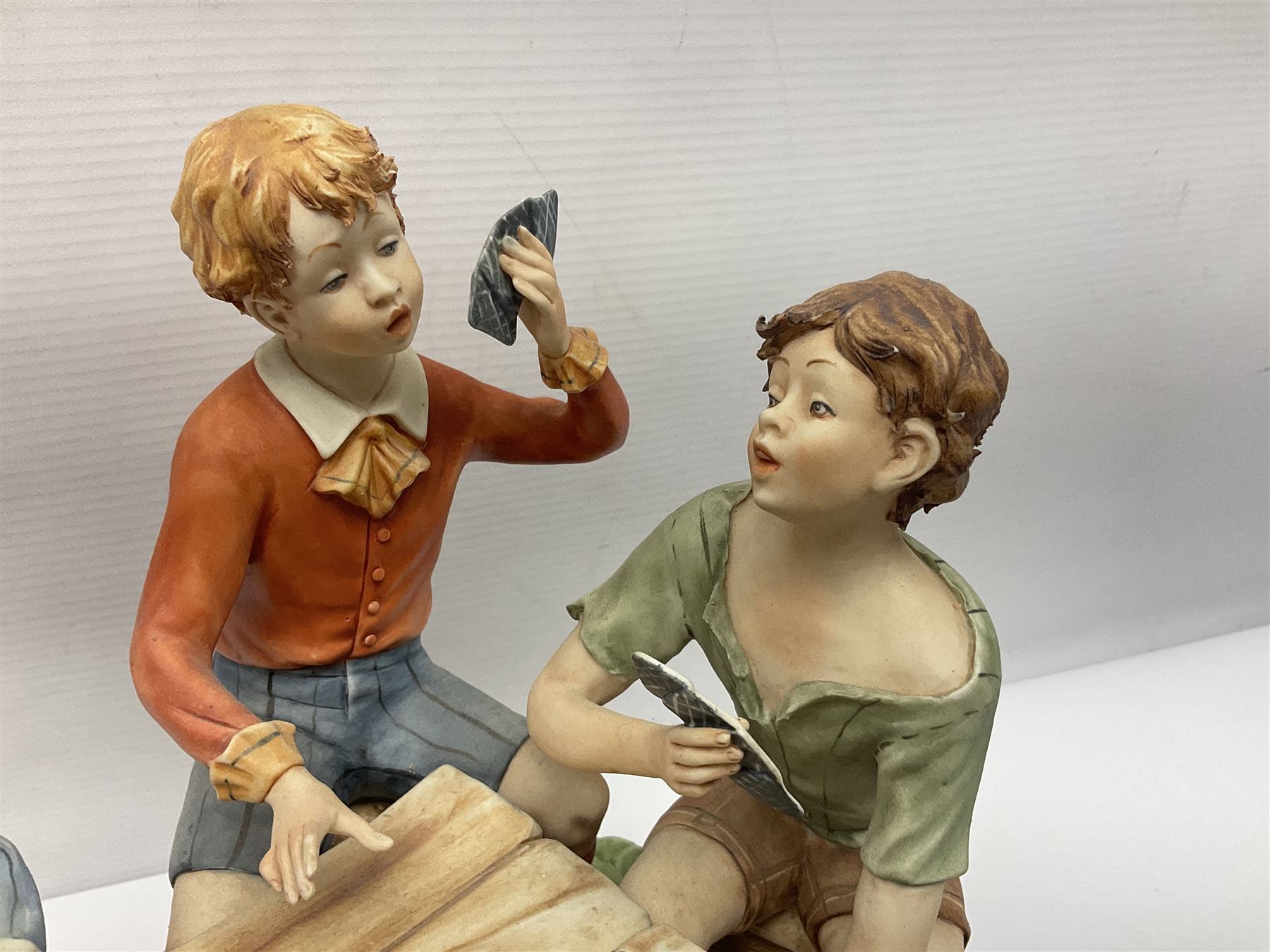 Capodimonte The Cheats, signed Zanella, together with another Capodimonte figure, H24cm  