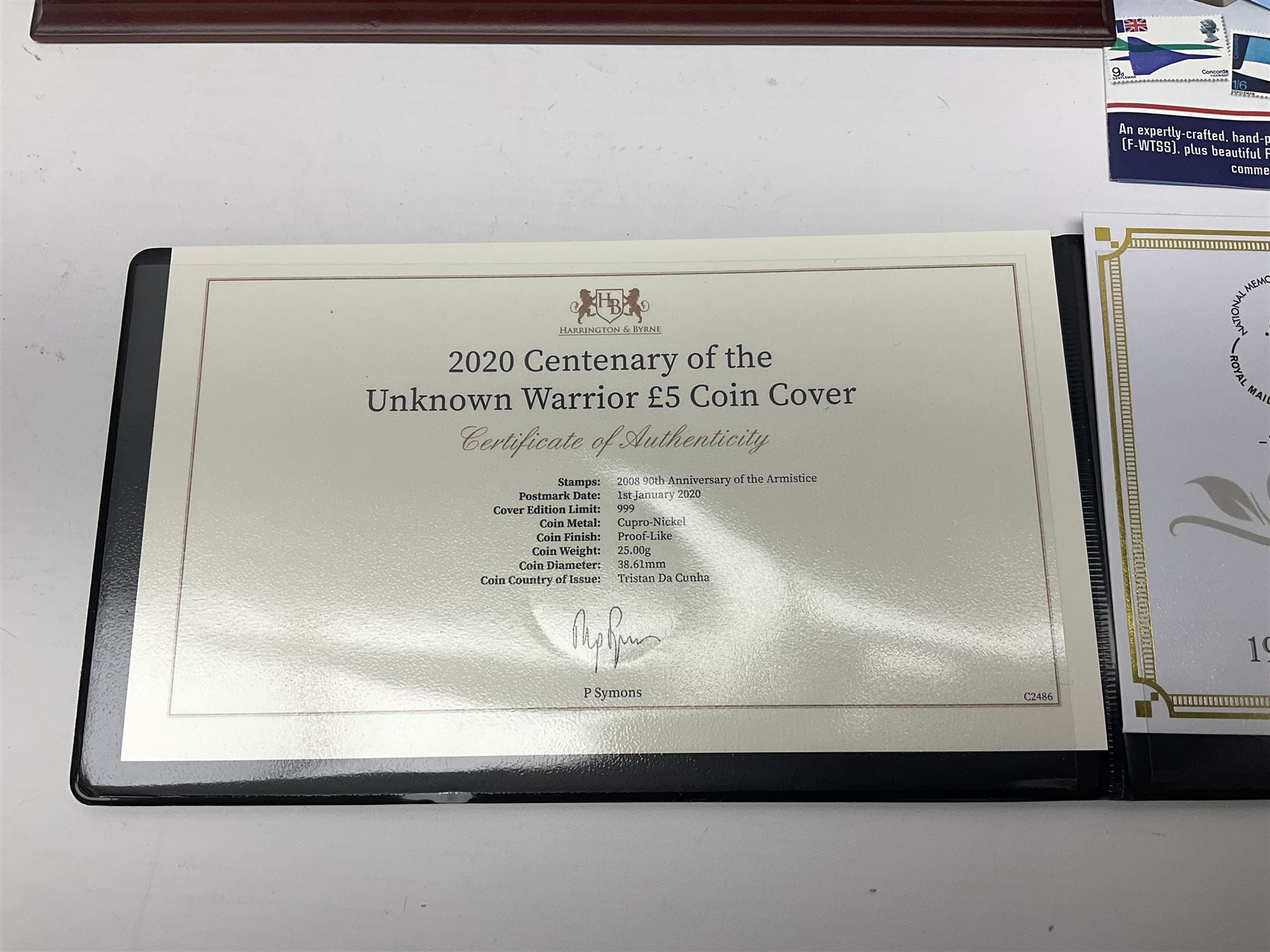 Danbury Mint 'The Ultimate James Bond Collection' comprising stamps and coins housed in a display case, 'Concorde Queen of the Skies' sculpture, stamps, medallion display and 2020 'Centenary of the Unknown Warrior' five pound coin cover in Harrington and Byrne folder