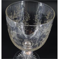 Late 19th century oversized glass goblet, the bowl engraved with cartouche containing dedication 'Jams Michie Died Jan 6th 1871 Aged 26 Years', surrounded by foliate detail, upon a hollow knopped stem containing a silver Victorian 1861 threepence and circular foot with star cut base, H19.5cm