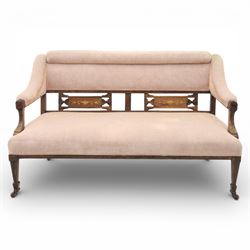 Quality Edwardian seven piece inlaid salon suite, comprising three seater settee, pair of arm chairs and four chairs with pierced splat backs, upholstered in pale pink fabric, inlaid with flowering urns, upon tapering legs with spade feet and castors