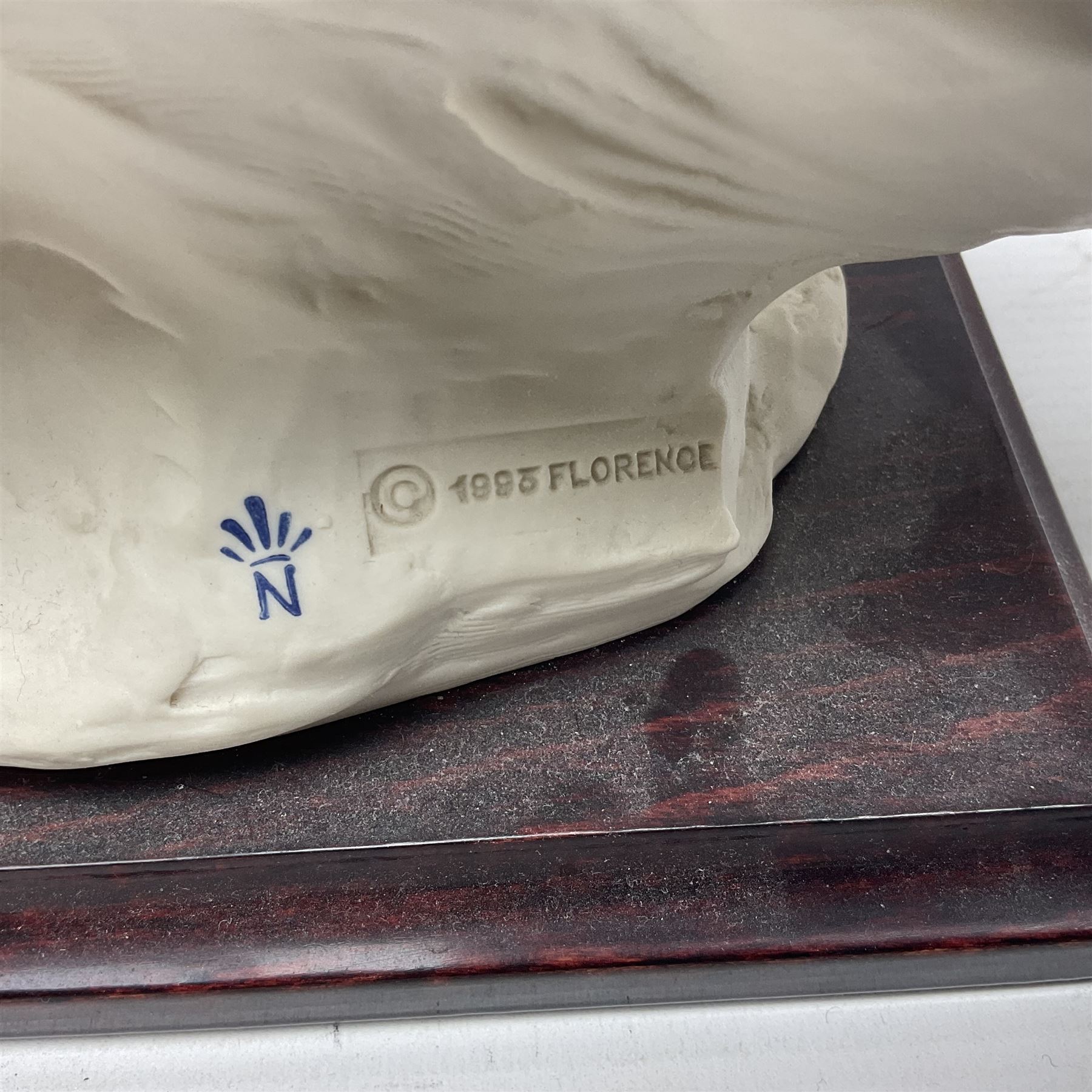 Giuseppe Armani Florence figure, Black Maternity, modelled as a mother and child upon a stylised cloud and mahogany base, H32cm