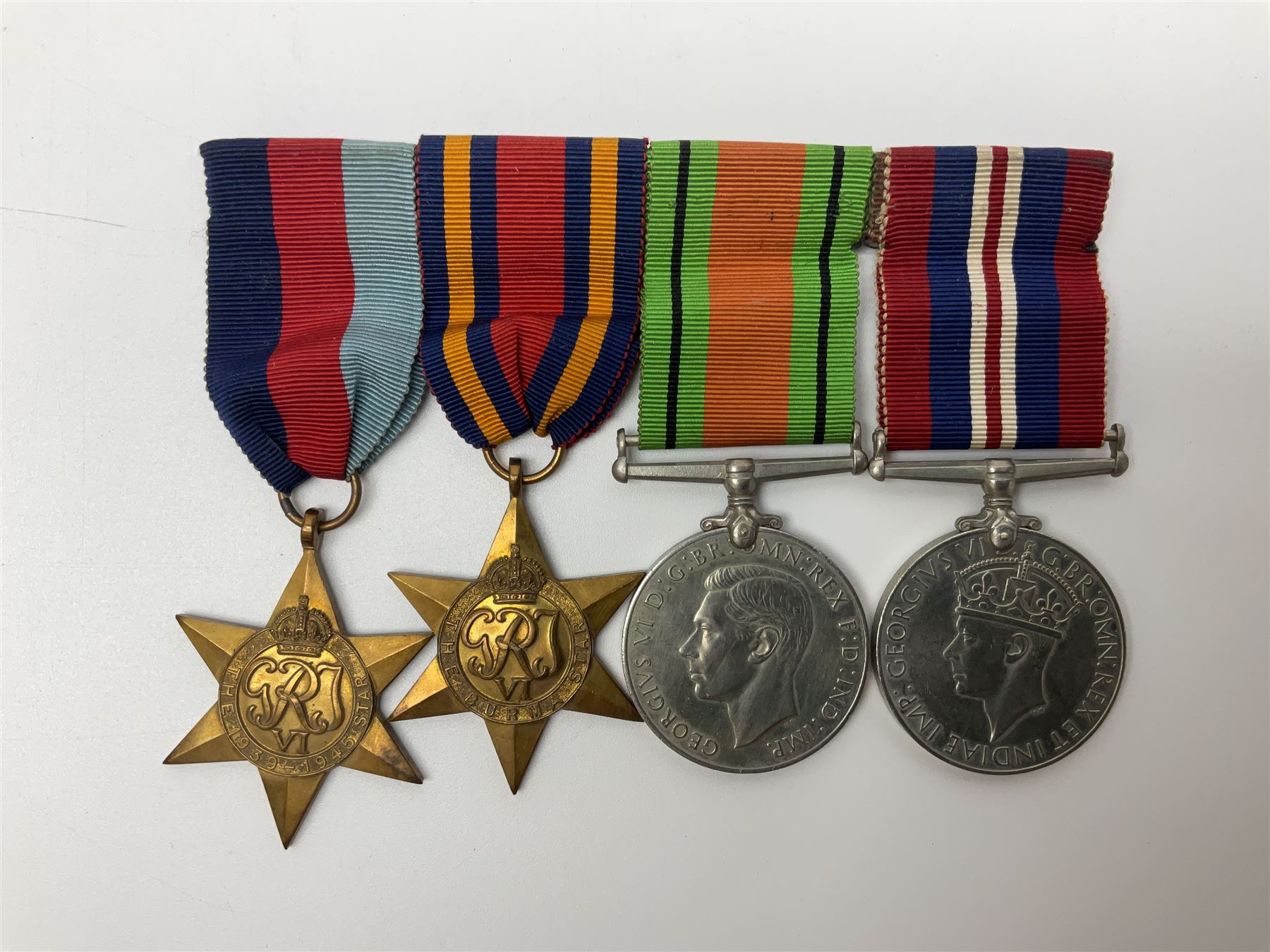 Collection of WW2 and police medals c.1933-1955, awarded to Eric Drinkwater comprising 1939-45 War Medal, Defence Medal, 1939-45 Star and Burma Star, on wearing bar; 1918-62 General Service Medal with Cyprus clasp to P.S. E.G. Drinkwater; boxed; Police Long Service and Good Conduct Medal to Const. Eric C. Drinkwater; cased; Royal Life Saving Society bronze medal to E.C. Drinkwater July 1933; boxed; and George V 1937 coronation medallion; boxed.