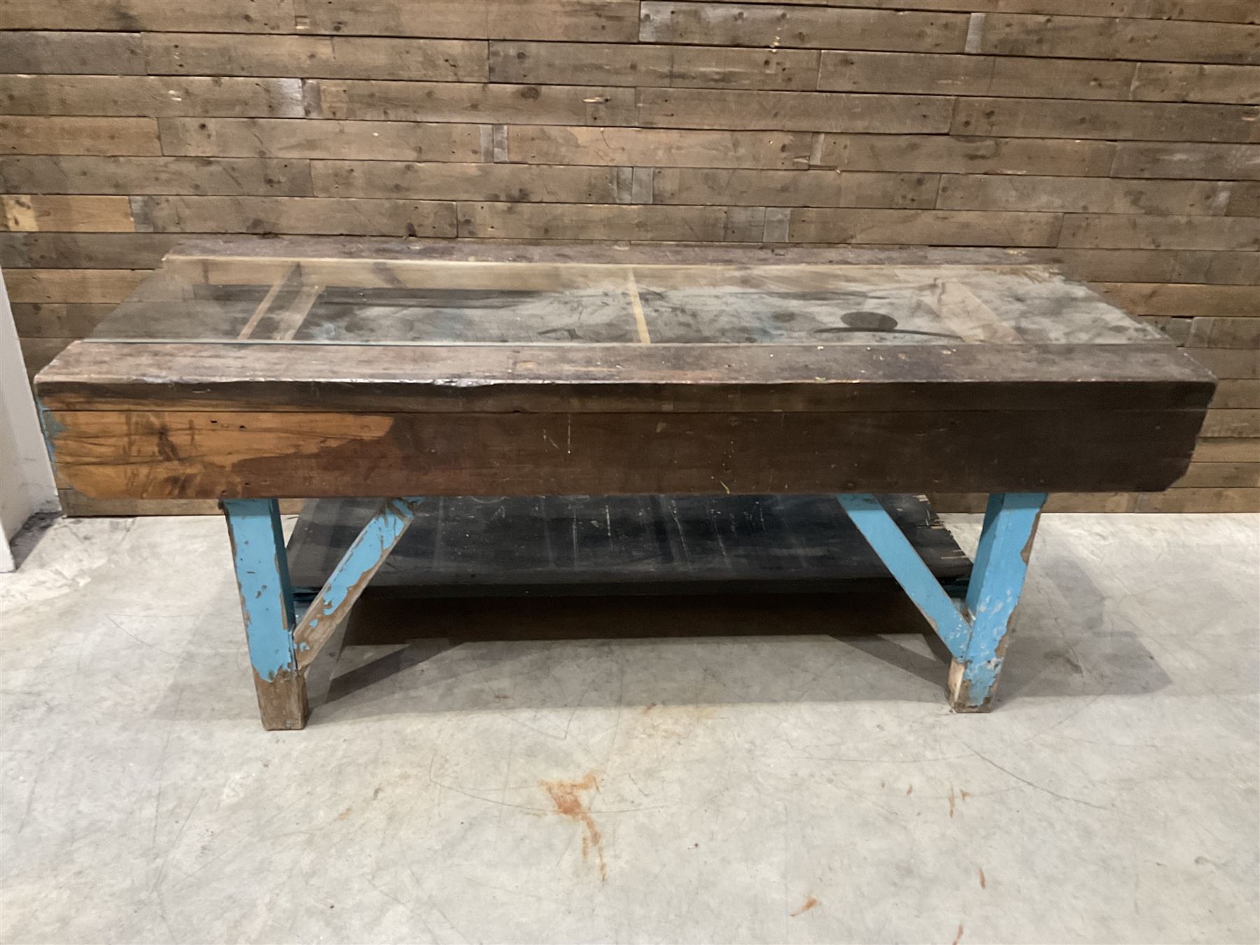 Large timber work bench with central glass section, and two pairs of vintage wooden step ladders (3)