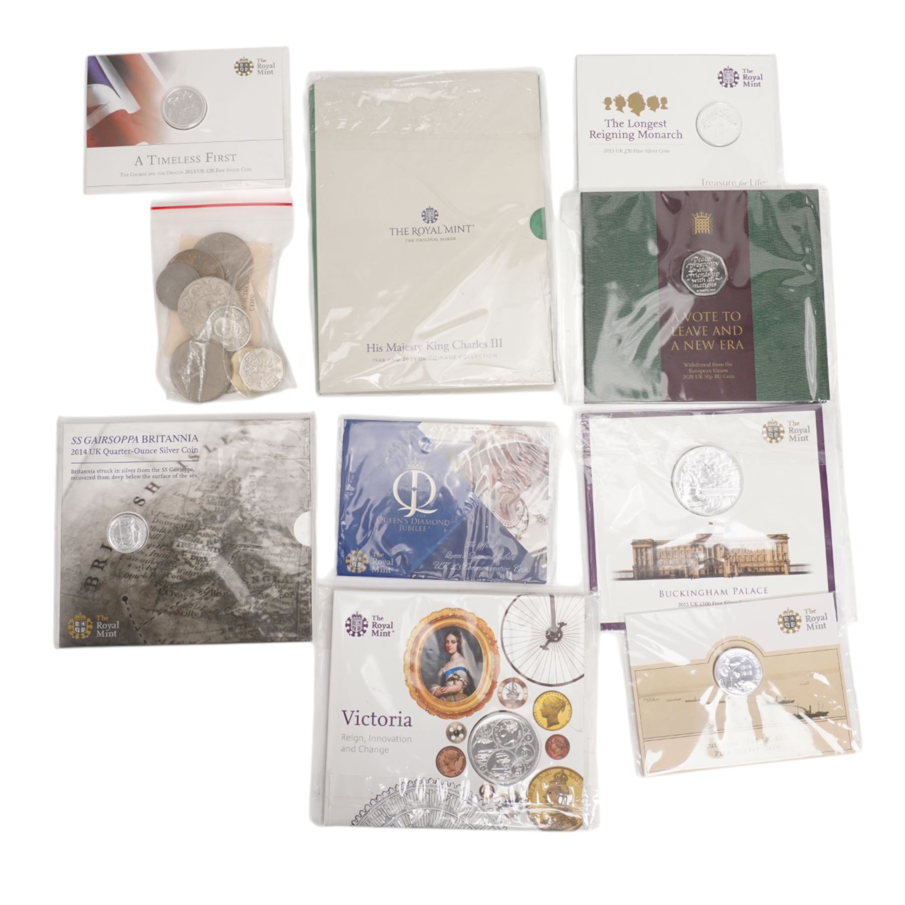 The Royal Mint United Kingdom 2015 'Buckingham Palace' fine silver one hundred pound coin, three fine silver twenty pound coins, comprising 2013 'A Timeless First', 2014 'Outbreak', and 2015 'The Longest Reigning Monarch', 2014 'SS Gairsoppa Britannia' quarter ounce silver coin, His Majesty King Charles III 1948 and 2023 Coinage Collection, two commemorative five pound coins, etc