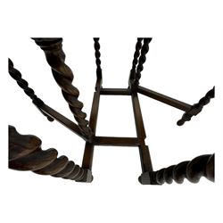 Early 20th century oak gateleg table, oval top with drop leaves supported by barley twist swing supports, united by plain stretchers, on turned feet (W119cm, D92cm, H77cm);