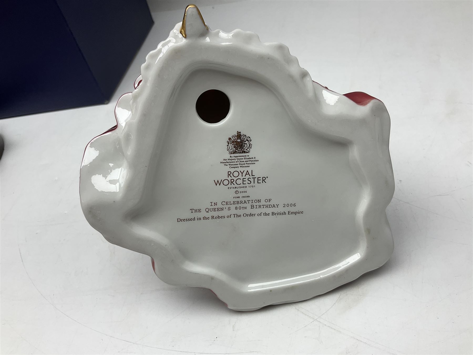 Three Royal Worcester figures, comprising Glyndebourne, with original box, Royal Worcester Special Even 1998 Elizabeth, with certificate and original box, and In Celebration of the Queens 80th Birthday 2006 