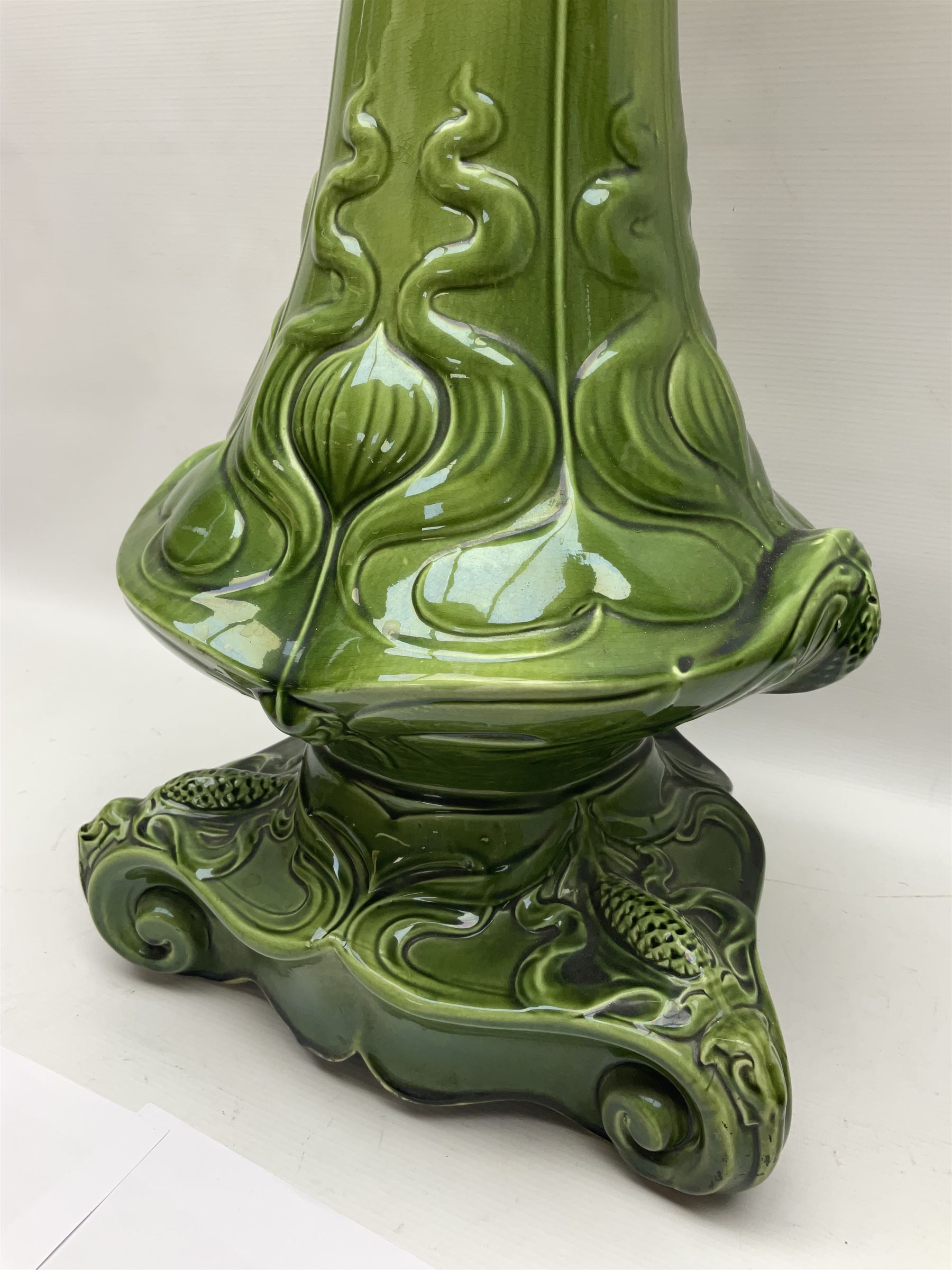 Jardiniere and stand, the jardiniere modelled as a pale, the stand with foliate and foliage decoration on a green ground, stand H73cm 