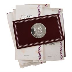 John Pinches 'The 100 Greatest Masterpieces' set of one hundred silver medallions, each on presentation card with information leaflet, together with the corresponding wooden display cabinet