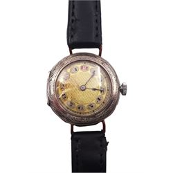 Rolex silver manual wind ladies wristwatch, gilt dial with Arabic numerals and red 12 o'clock, case No. 1300968 with bright cut floral decoration, on black leather strap