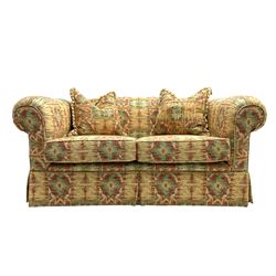 Two seat traditional shape sofa upholstered in Kilim print fabric, with scatter cushions