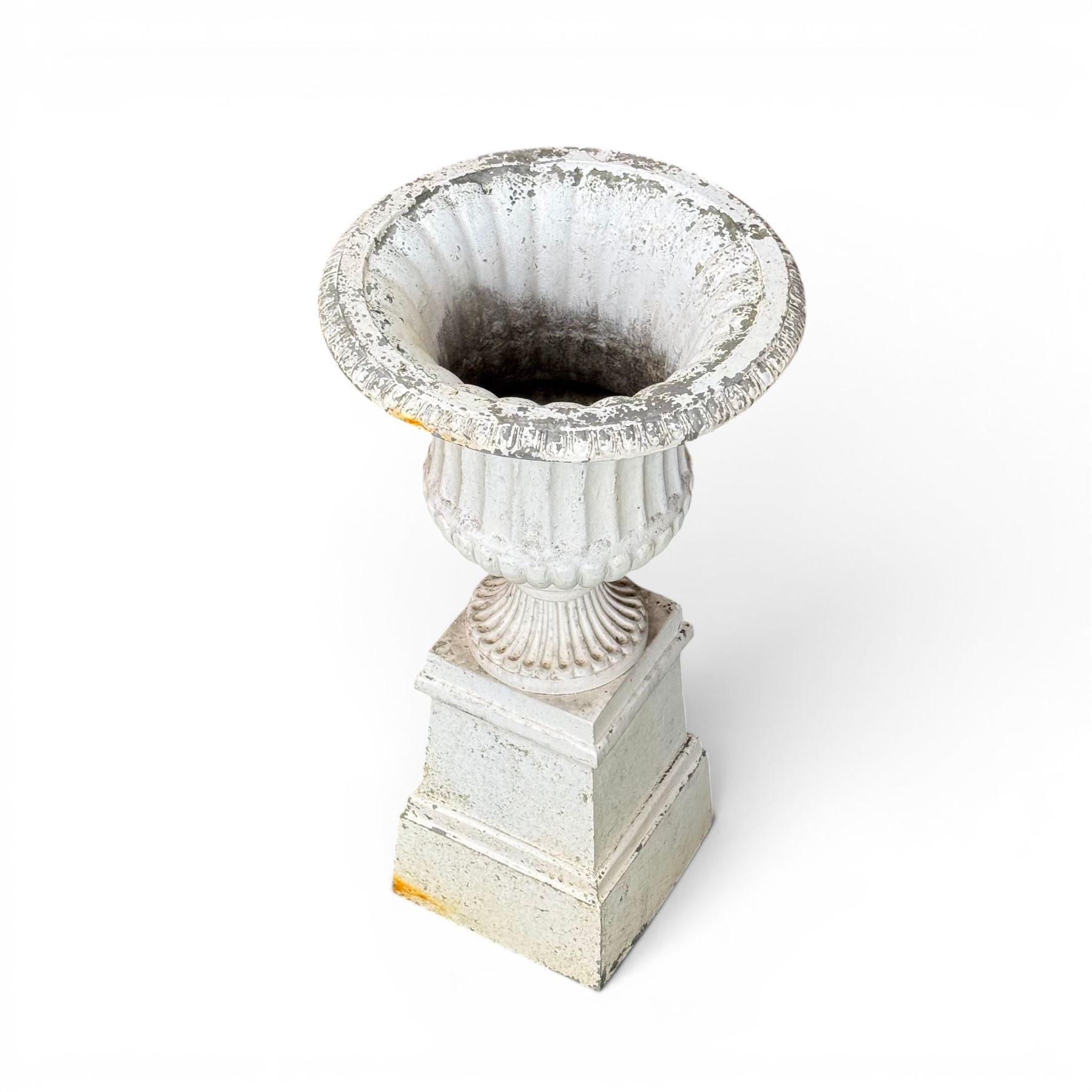 Victorian design white painted cast aluminium garden urn on plinth, fluted bowl on squat pedestal, tapering base