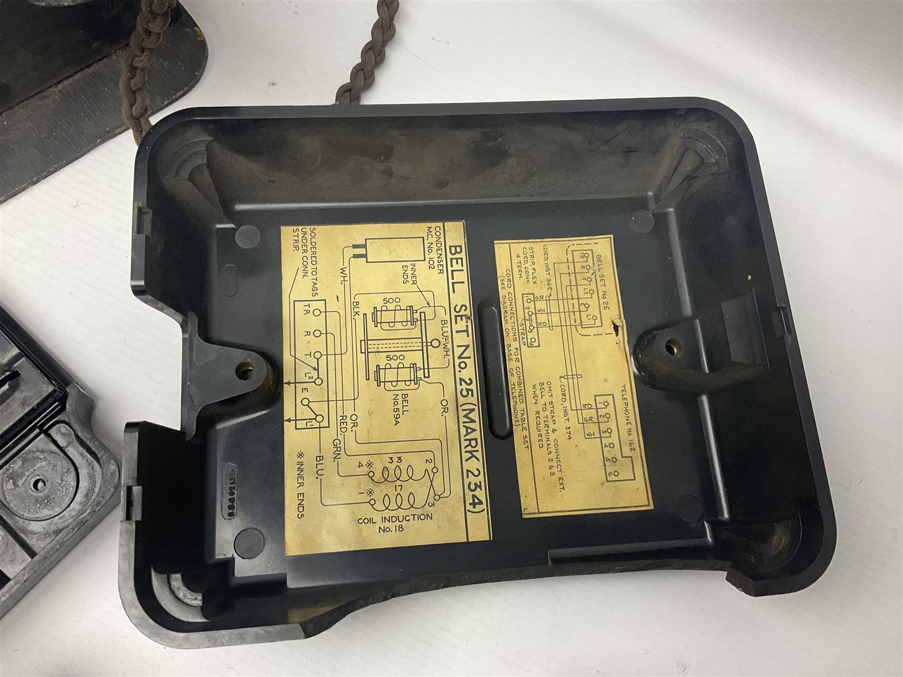 Collection of phone headsets, including GPO bakelite examples, together with other telephone parts 