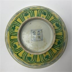 Pair of Chinese famille jaune bowls, decorated in green enamel with a dragon chasing a flaming pearl amongst clouds, upon a yellow ground, the interior decorated to centre with dragon, with six character mark beneath, D17.5cm