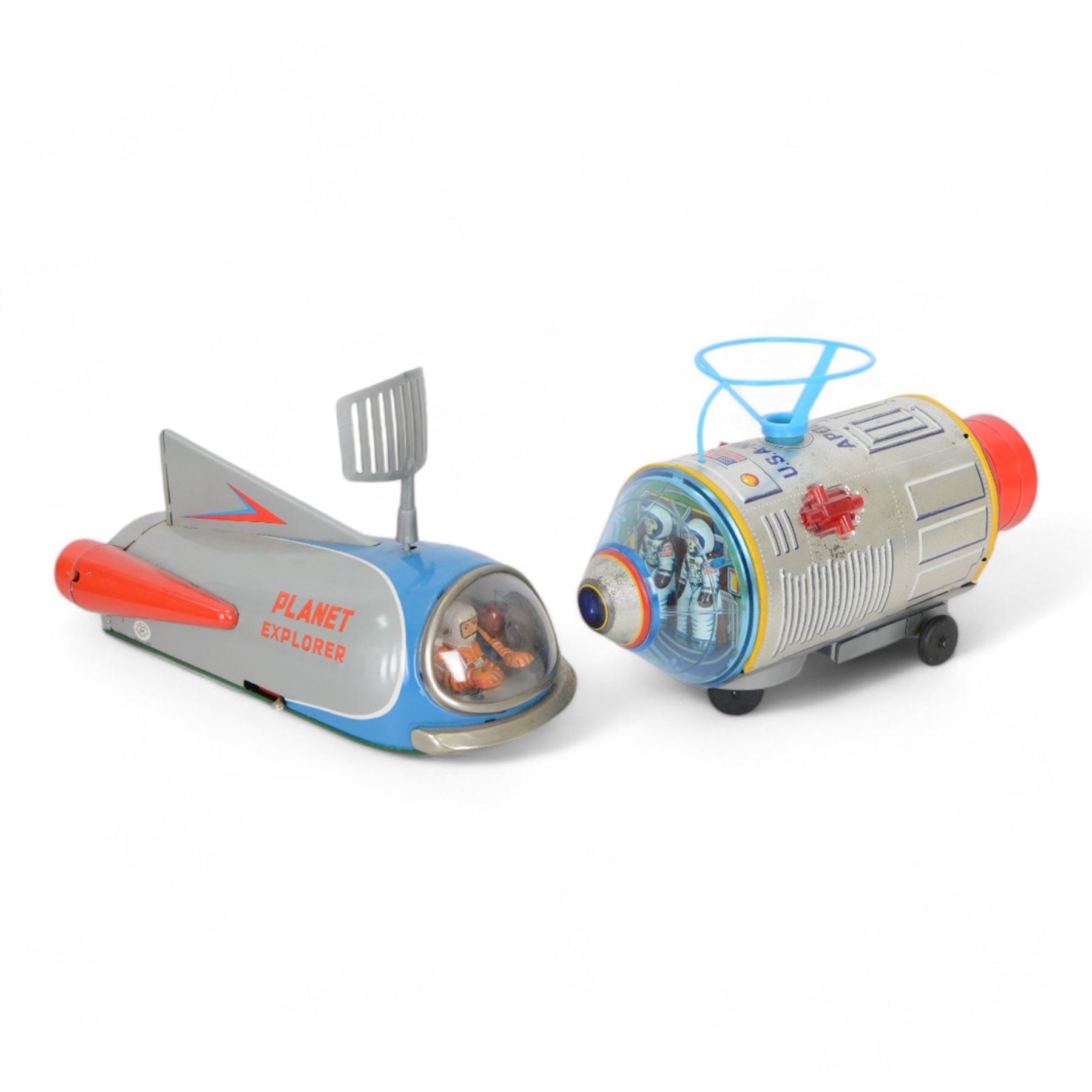 Two Japanese battery operated tinplate rockets by Modern Toys
