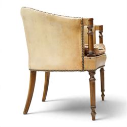 Early 20th century Georgian design mahogany framed desk or club armchair of tub form, with turned pilaster arm supports and legs with rear splayed supports, upholstered in faded tanned leather with loose seat cushion