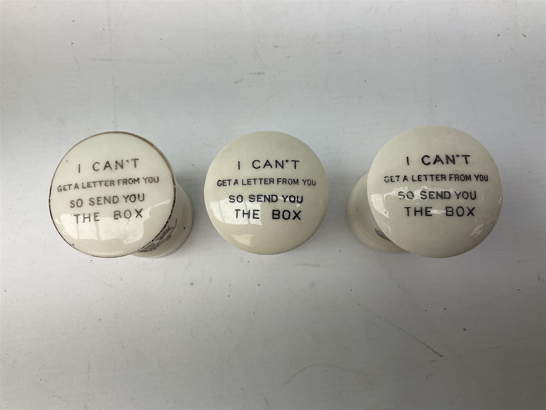 Collection of Post Box money boxes comprising ceramic, tin plate and plastic models, to include Crested Ware money boxes bearing motto ‘I Can’t Get a Letter From You So Send You The Box’ etc in three boxes