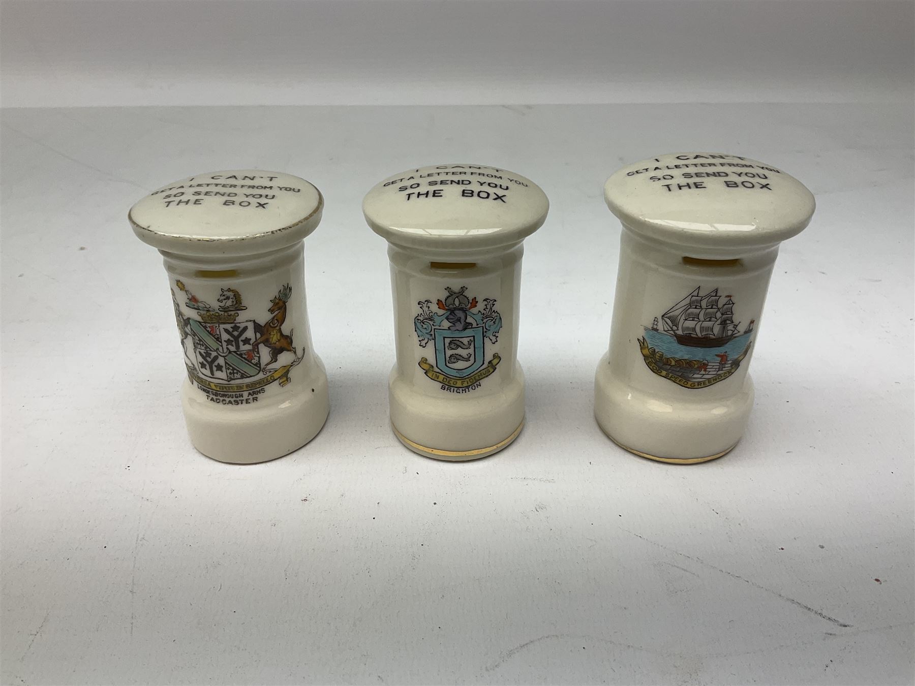 Collection of Post Box money boxes comprising ceramic, tin plate and plastic models, to include Crested Ware money boxes bearing motto ‘I Can’t Get a Letter From You So Send You The Box’ etc in three boxes