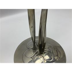 Archibald Knox (1864-1933) for Liberty & Co, pair of Tudric pewter candlesticks, the bud shaped sockets raised upon three angular fin supports and a slightly domed circular base with cast stylised foliate decoration, each stamped beneath Tudric 0223, H30cm
