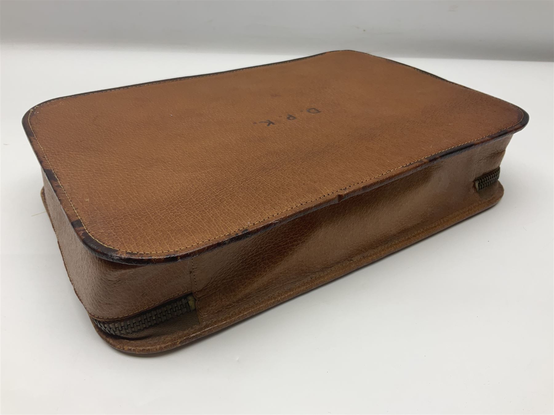 Mappin & Webb leather cased campaign gentleman's vanity set, the tan leather case opening to reveal fitted interior with five engine turned silver capped glass vanity bottles, hallmarked Mappin & Webb, London 1944, brushes, mirror etc, monogram DPK to the top of the case