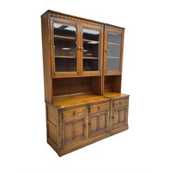 Ercol - medium elm wall display cabinet, fitted with three glaszed cupboards, three drawers and three panelled cupboards