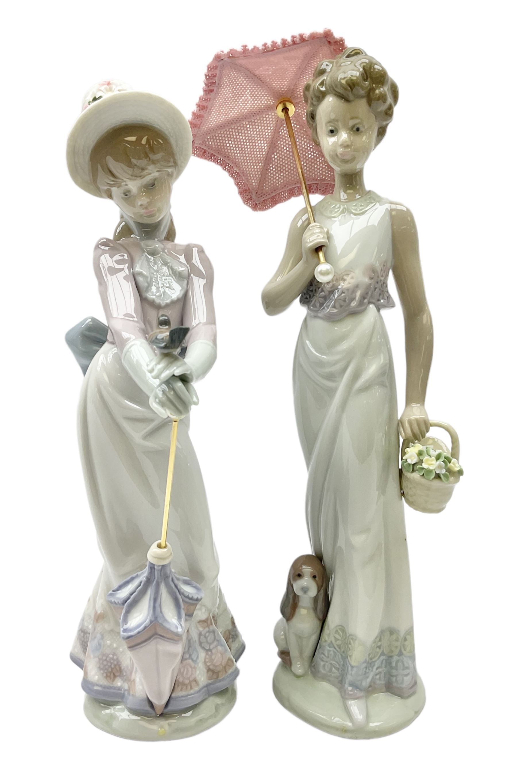 Two Lladro figures, comprising Garden Classic, no 7617 and Garden Song, no 7618, with original boxes and artists signature beneath, largest example H23cm