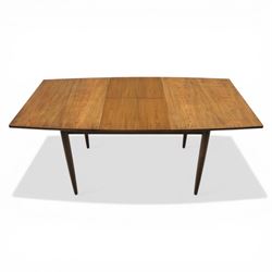 Ensign - Mid-20th century elm extending dining table, with fold out leaf, bow ends and sides; and four low stick back chairs, labelled Ensign Bristow & Townsend Ltd, extended 168cm