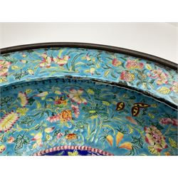 18th/19th century Chinese Canton enamel basin, the circular basin with flat everted rim, decorated with scrolling foliate and fruit decoration on a blue ground, D43cm